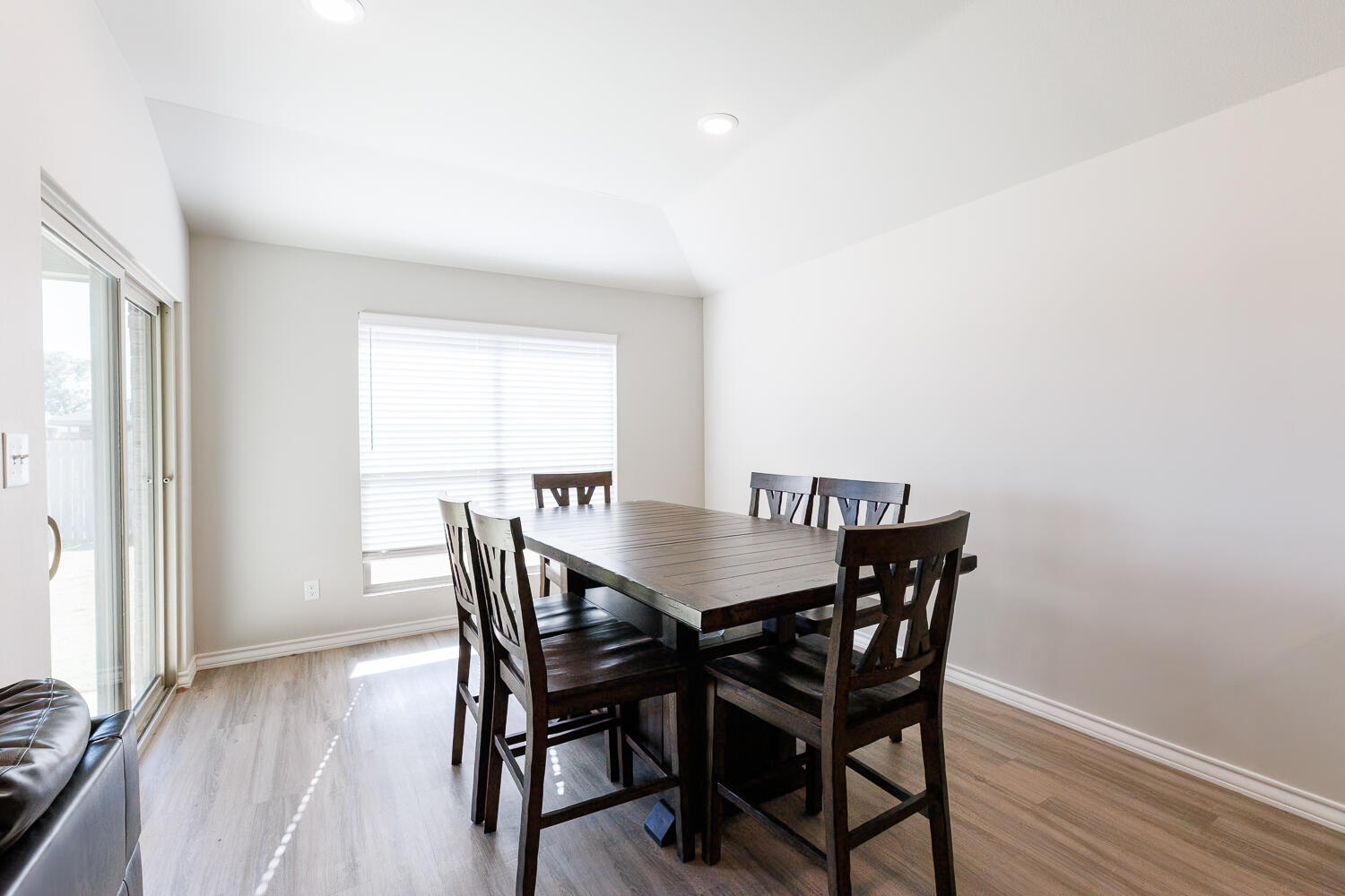 7205 25th Street Lubbock, TX 79407 - Photo 21 of 50 a view of a dining room with furniture and wooden floor