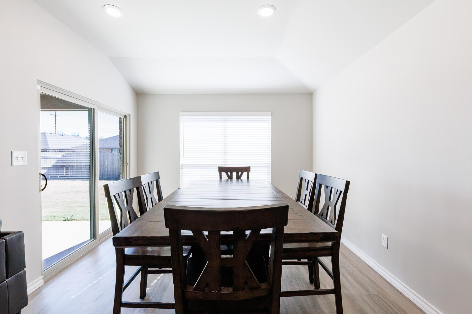 7205 25th Street Lubbock, TX 79407 - Photo 22 of 50 a view of a dining room with furniture and wooden floor