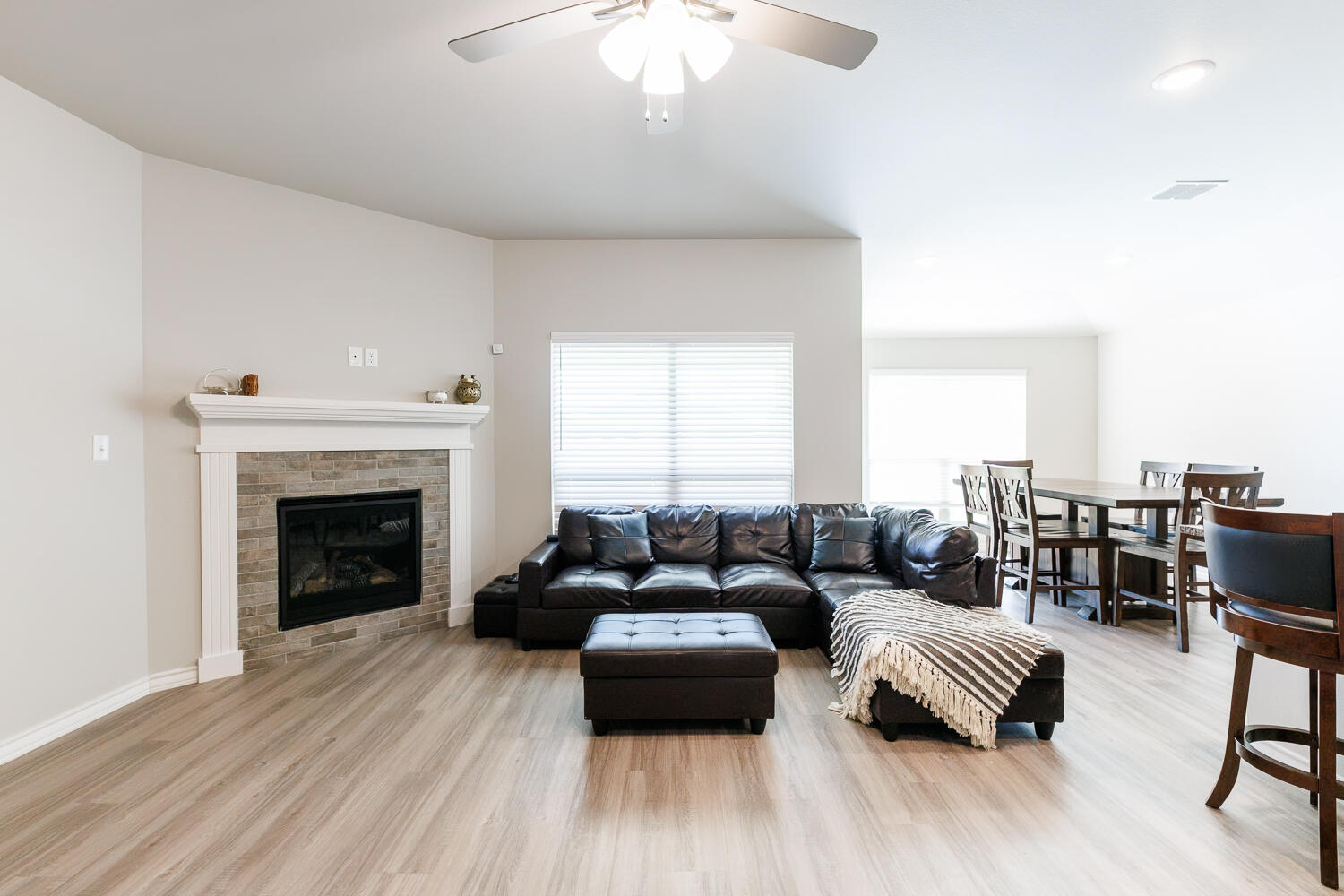 7205 25th Street Lubbock, TX 79407 - Photo 6 of 50 a living room with furniture and a fireplace