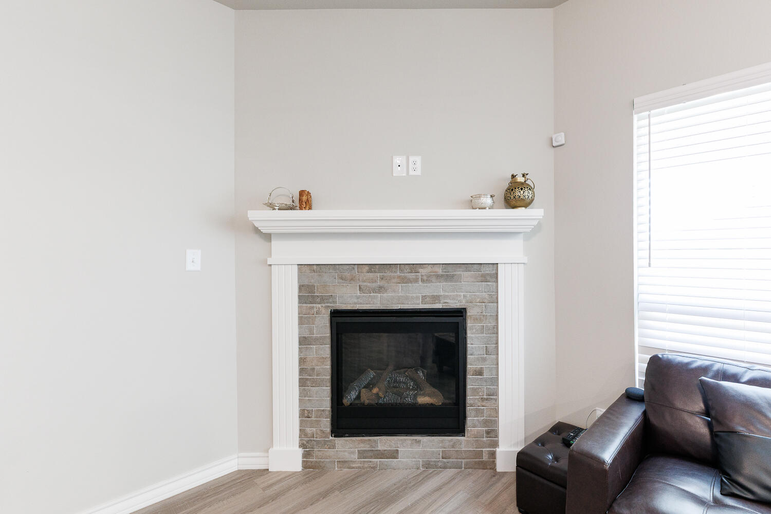 7205 25th Street Lubbock, TX 79407 - Photo 7 of 50 a living room with furniture and a fireplace