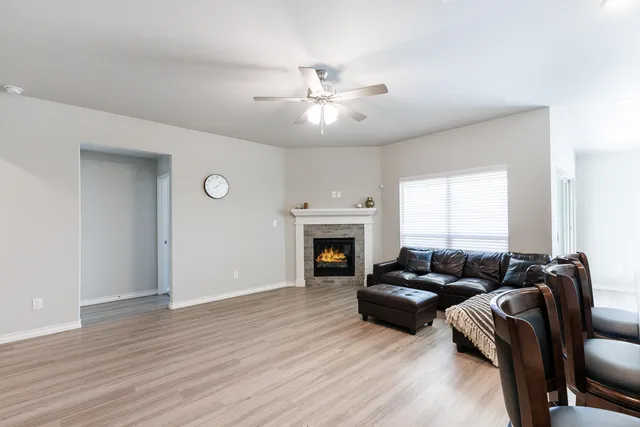 a living room with furniture and a fireplace