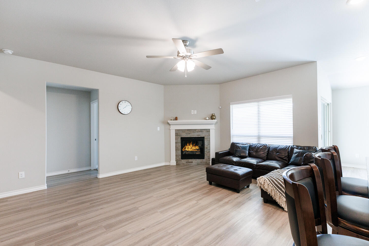 7205 25th Street Lubbock, TX 79407 - Photo 8 of 50 a living room with furniture and a fireplace