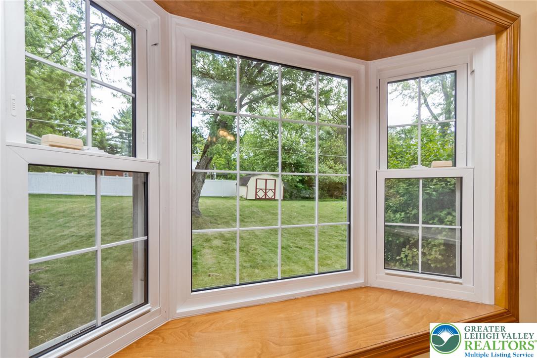 268 Apollo Drive Bethlehem, PA 18017 - Photo 16 of 56 A spacious bay window offers charming views of the private yard and storage shed.