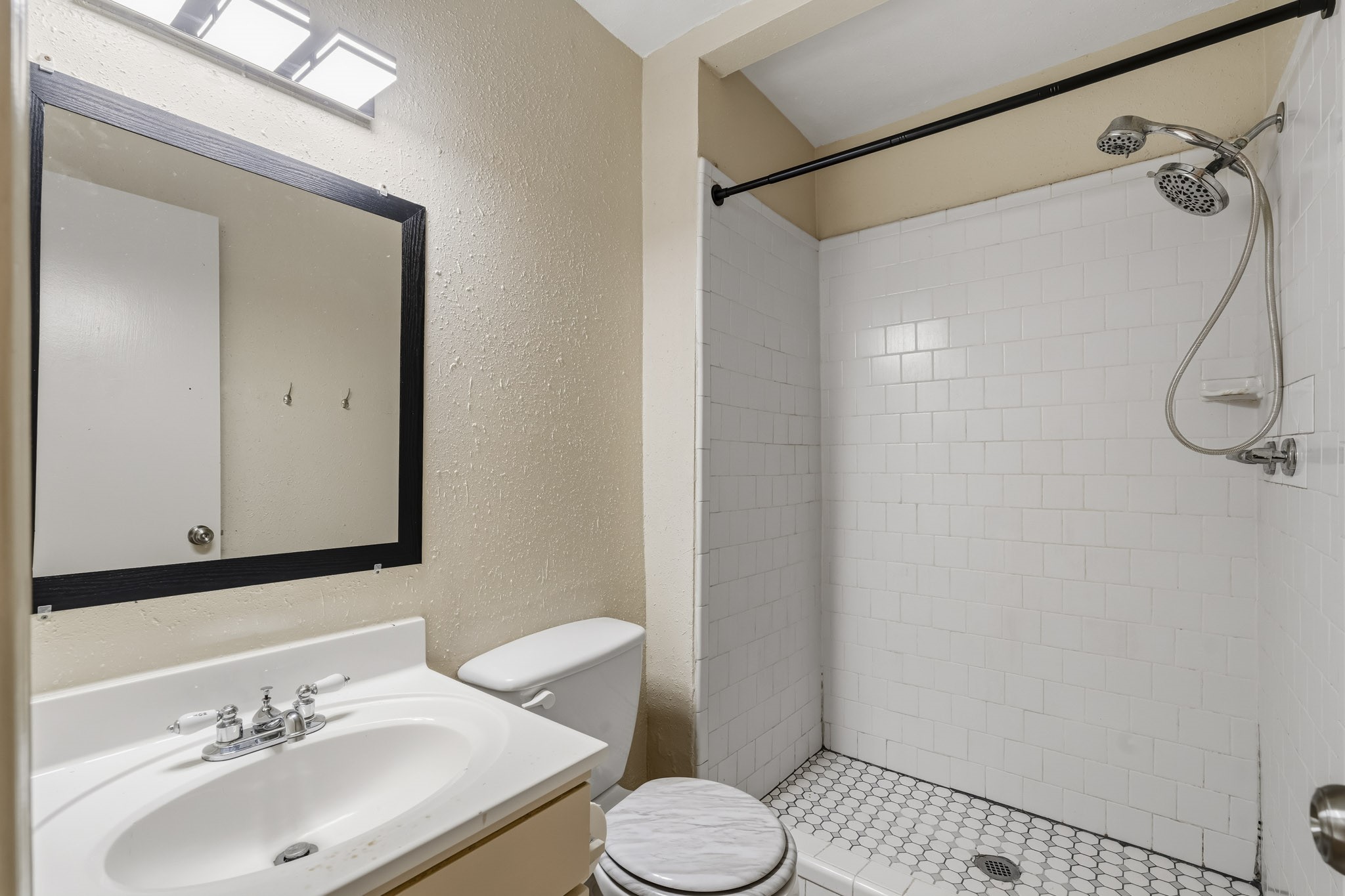 5315 Ridgestone Street Houston, TX 77053 - Photo 13 of 19 Primary ensuite bathroom featuring a walk-in shower and vanity.