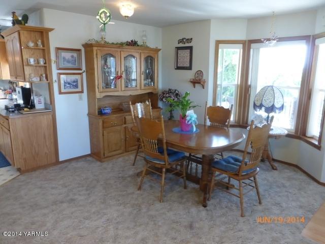 1640 Division Road Zillah, WA 98953 - Photo 4 of 49 a dining room with furniture and window