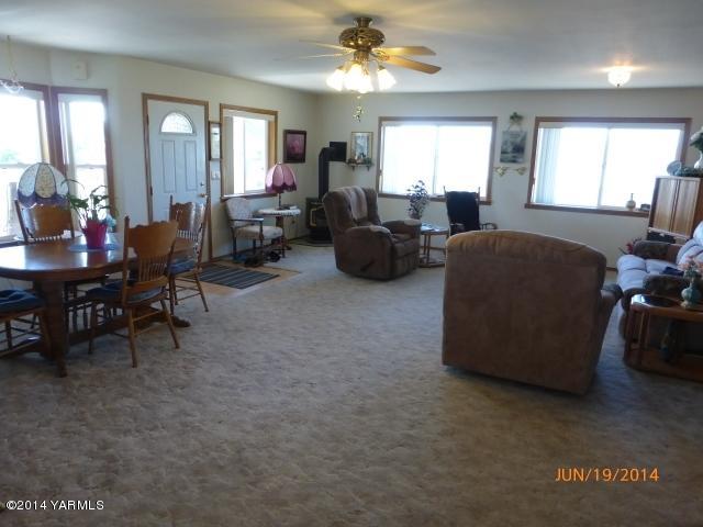 1640 Division Road Zillah, WA 98953 - Photo 6 of 49 a living room with furniture and a large window