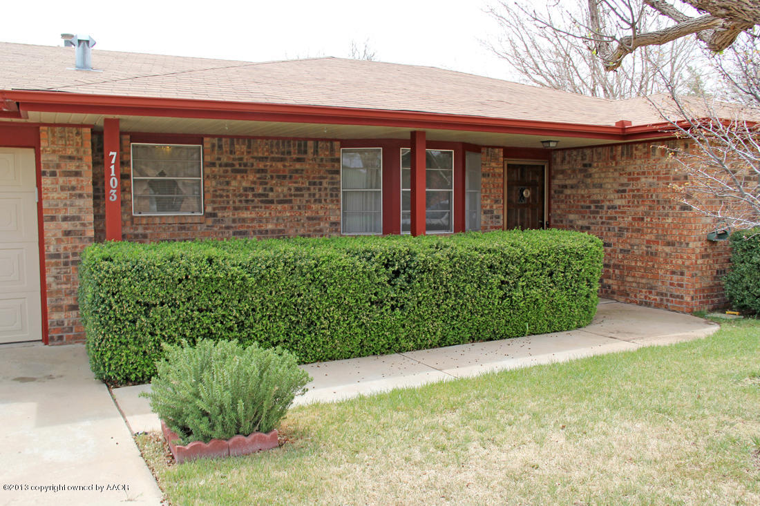 7103 Hatton Road Amarillo, TX 79110 - Photo 17 of 28 a front view of a house with garden