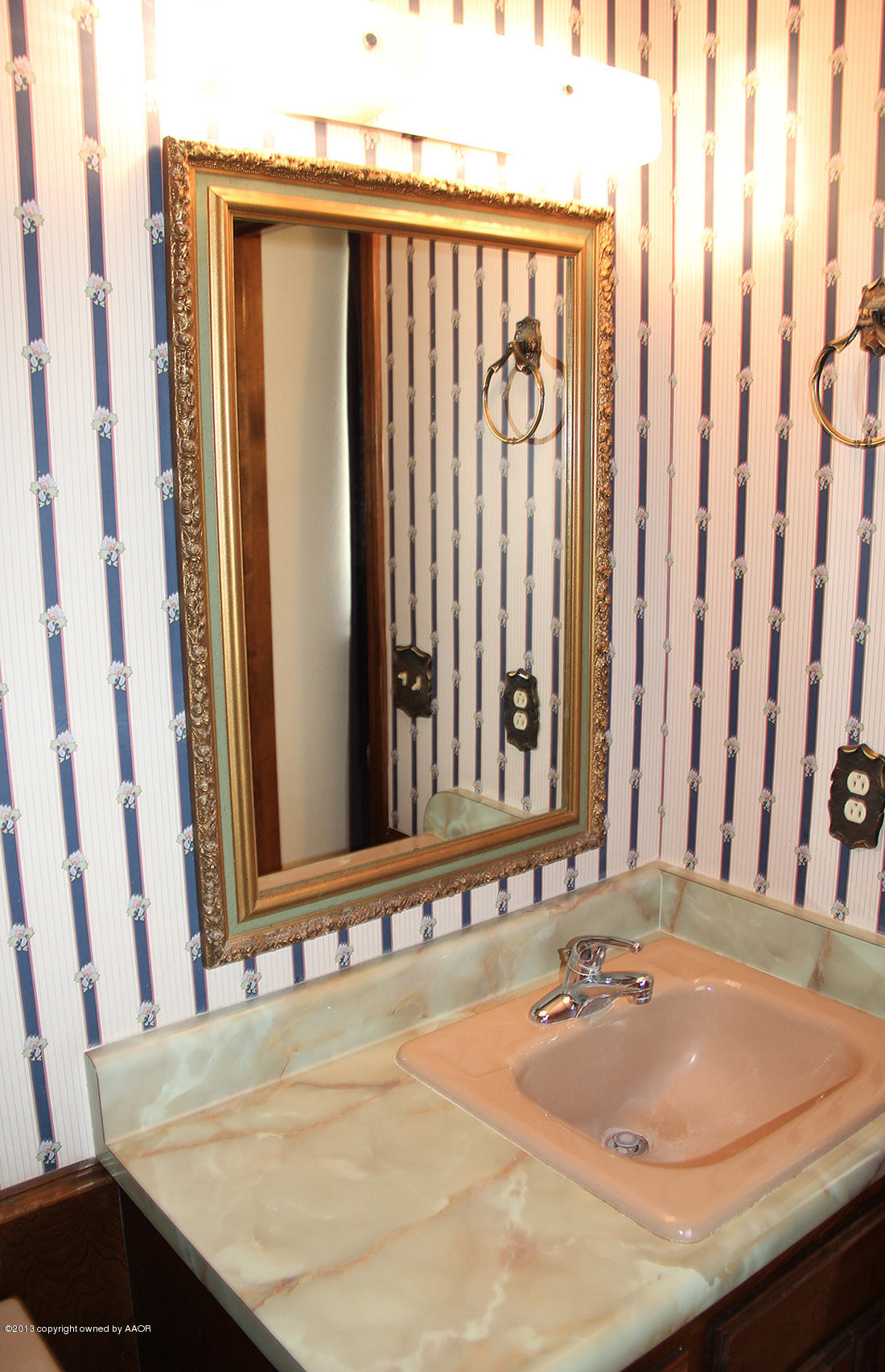 7103 Hatton Road Amarillo, TX 79110 - Photo 24 of 28 a bathroom with a granite countertop sink and a mirror