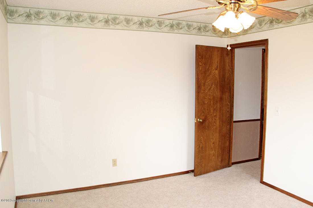 7103 Hatton Road Amarillo, TX 79110 - Photo 27 of 28 a view of a closet and chandelier fan in a room