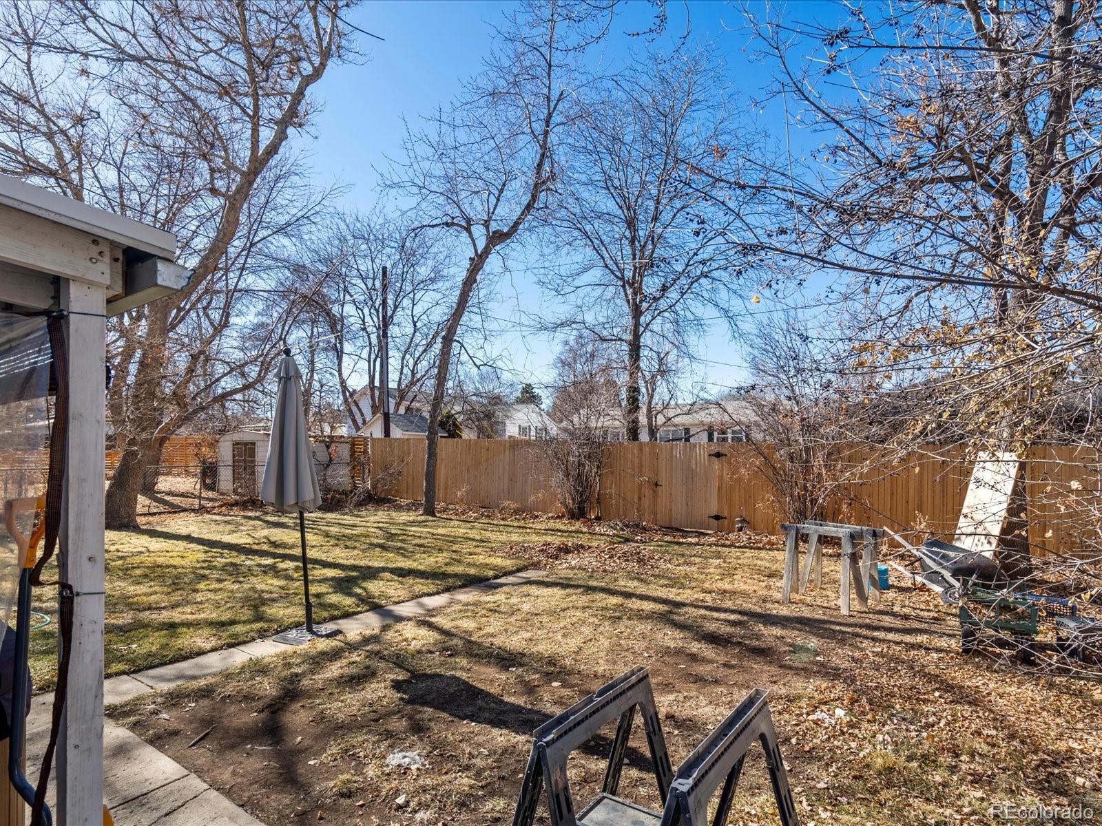 3145 South Ash Street Denver, CO 80222 - Photo 22 of 24 a view of a backyard with wooden fence