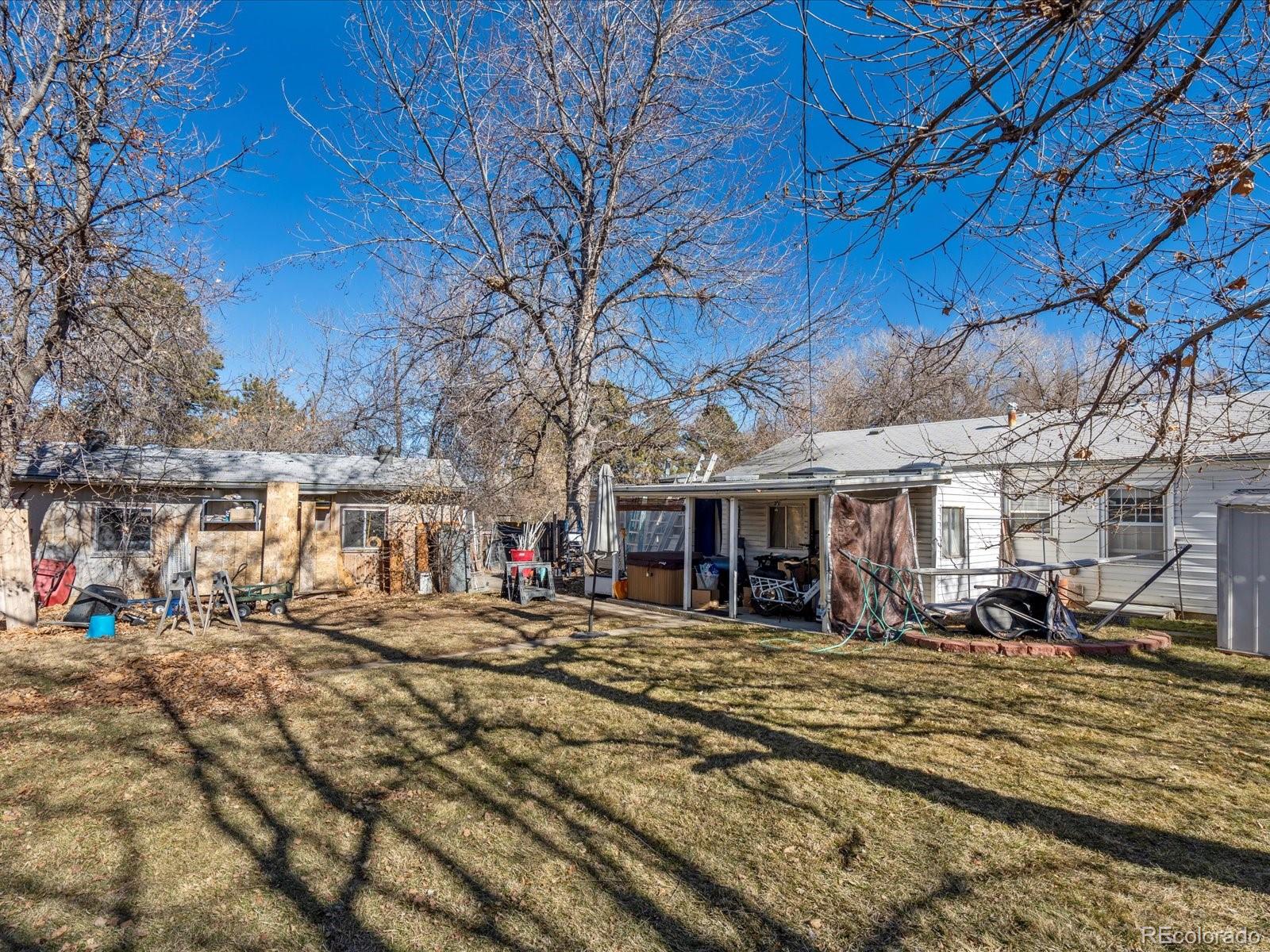 3145 South Ash Street Denver, CO 80222 - Photo 23 of 24 a view of a yard with a patio