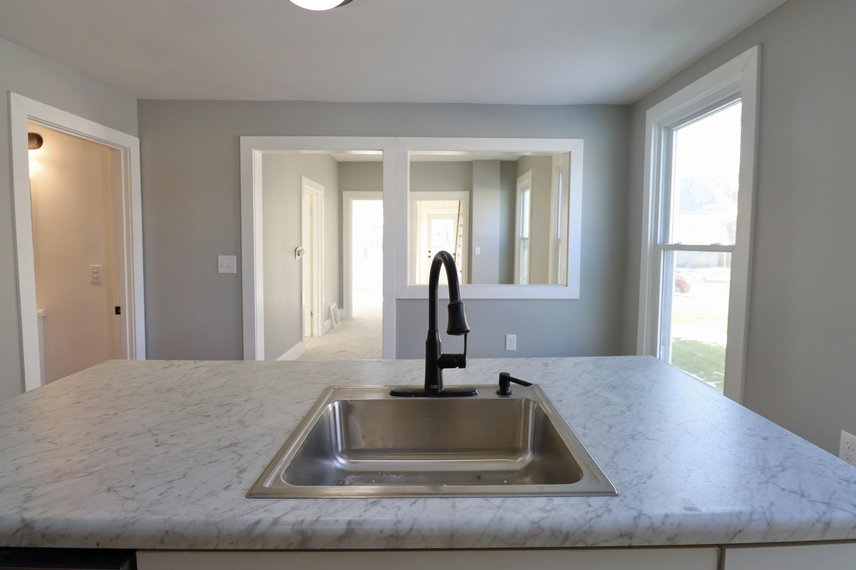 117 Patton Street La Porte, IN 46350 - Photo 11 of 45 a kitchen with sink and window