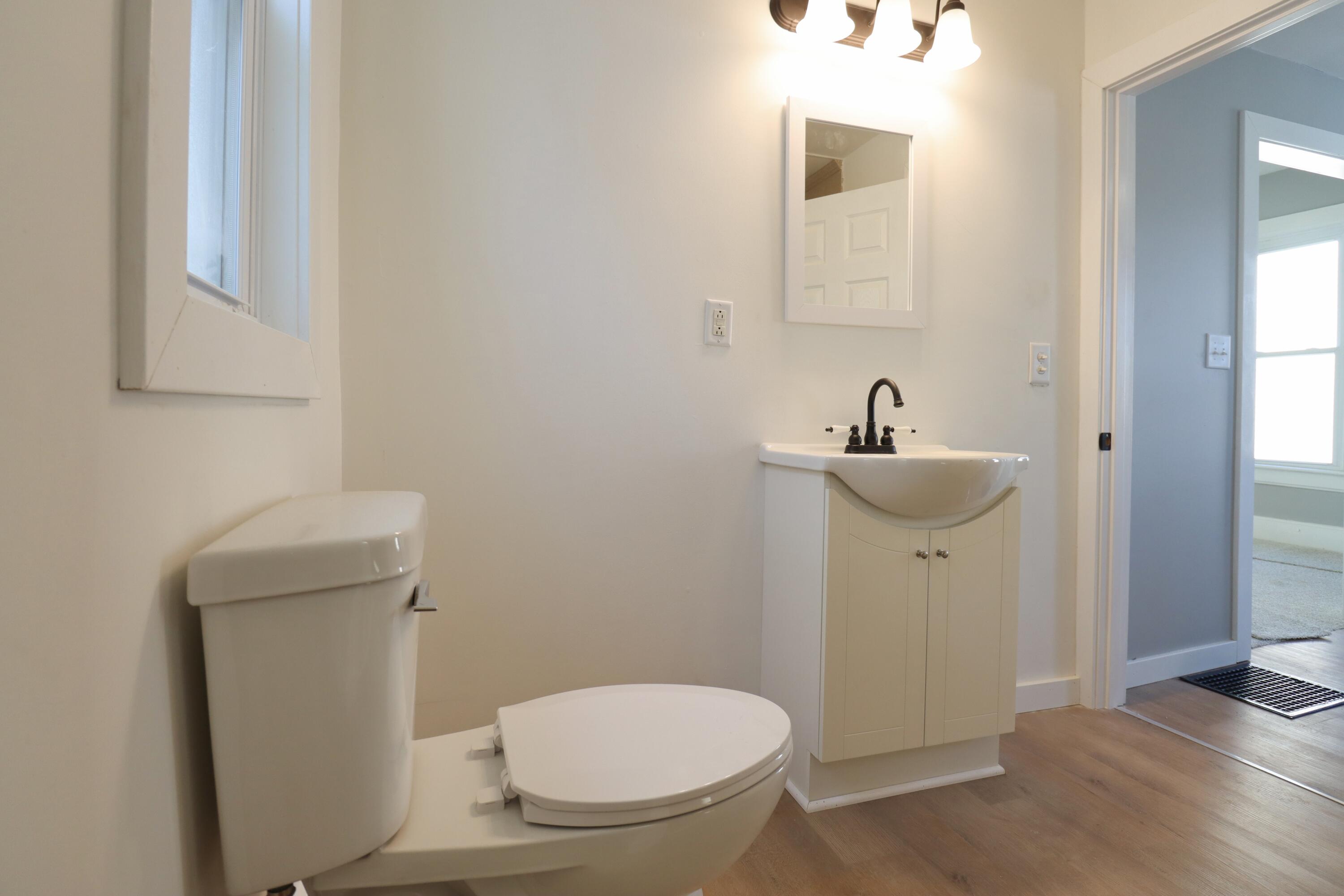 117 Patton Street La Porte, IN 46350 - Photo 17 of 45 a white toilet sitting next to a bathroom sink