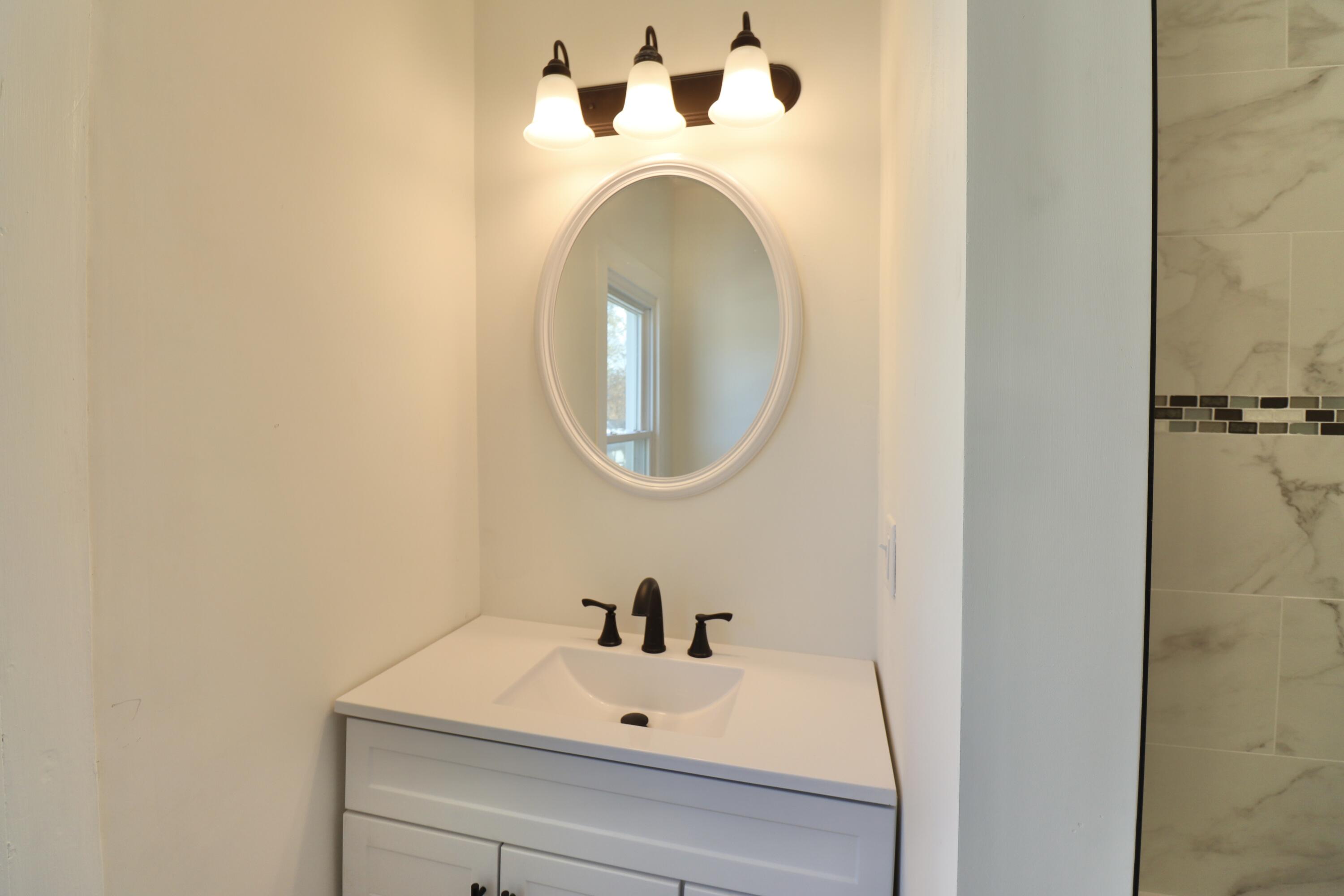 117 Patton Street La Porte, IN 46350 - Photo 30 of 45 a bathroom with a sink and a mirror