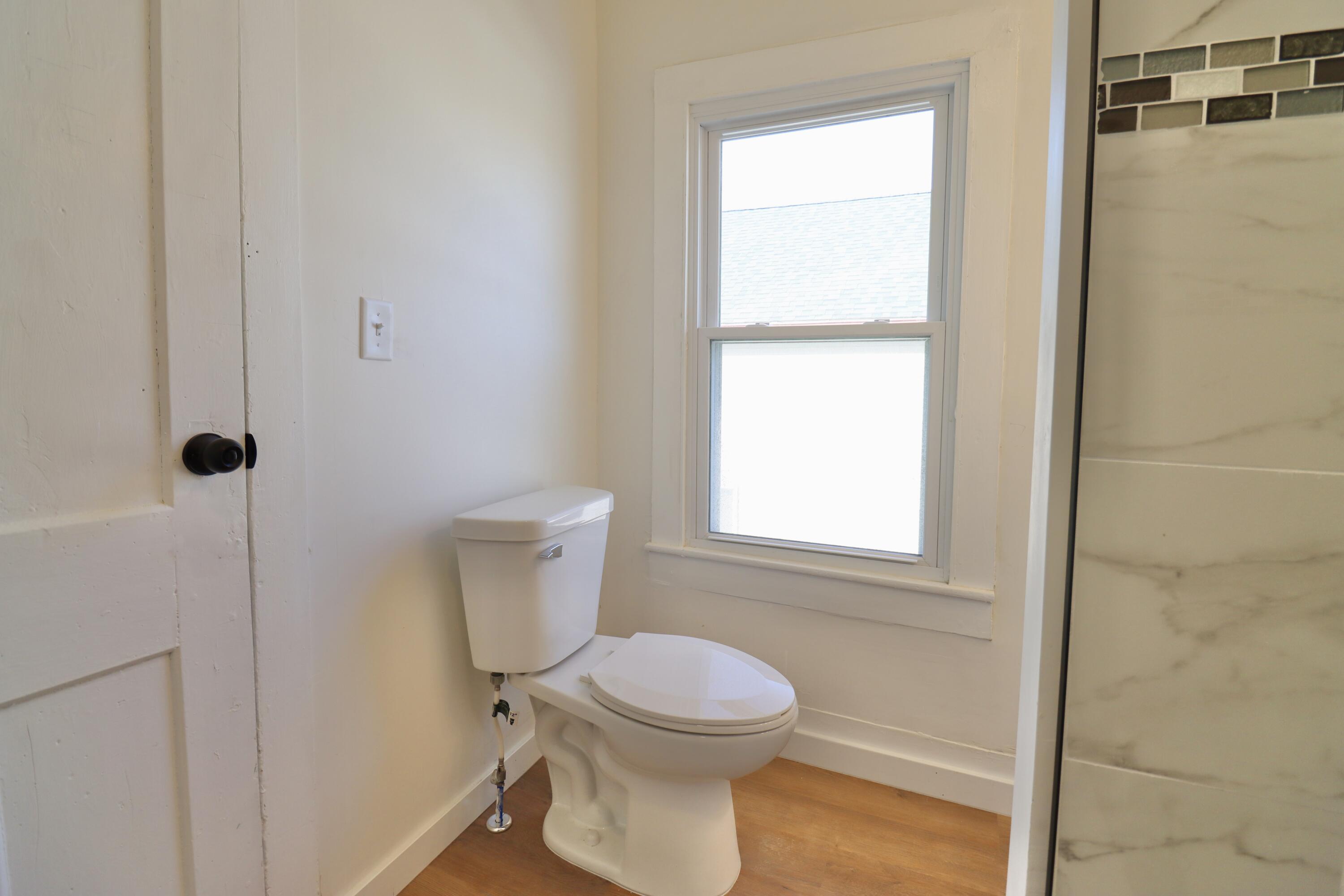 117 Patton Street La Porte, IN 46350 - Photo 31 of 45 a bathroom with a toilet and a sink