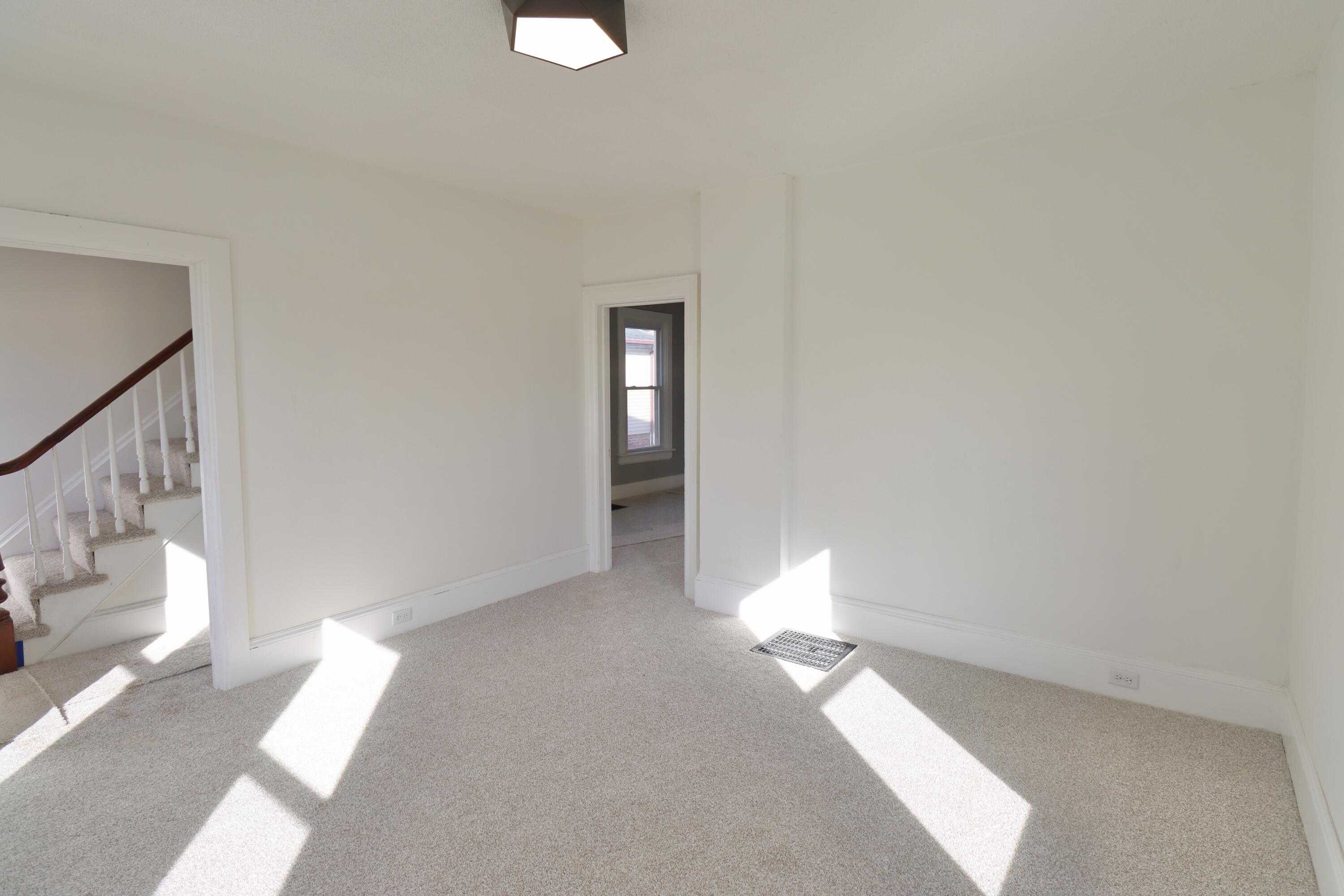 117 Patton Street La Porte, IN 46350 - Photo 6 of 45 a view of entryway and hall with wooden floor