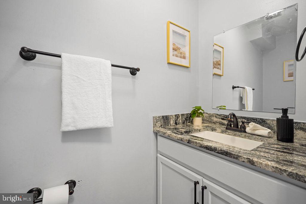 1337 Ward Street Baltimore, MD 21230 - Photo 7 of 17 a bathroom with a sink and a mirror