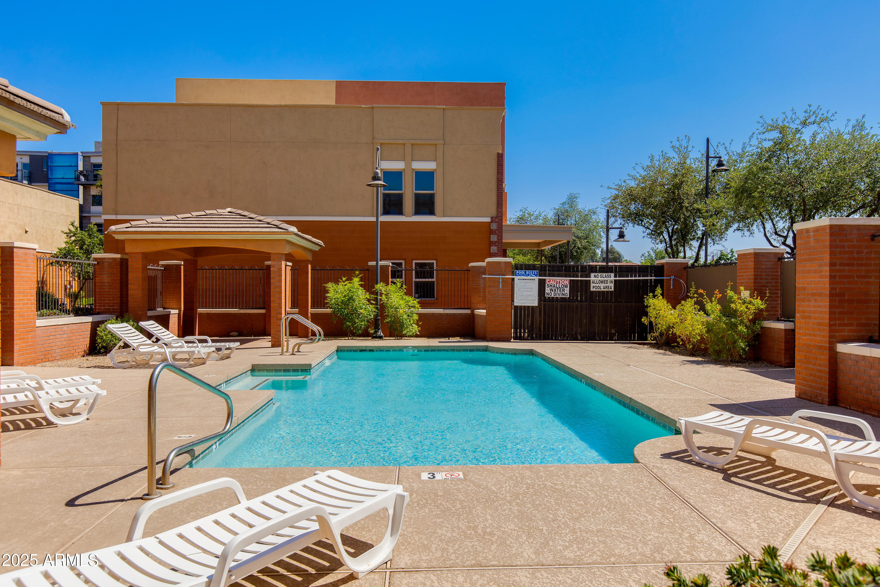 581 South Roosevelt Street Tempe, AZ 85281 - Photo 13 of 14 a view of backyard with swimming pool and furniture