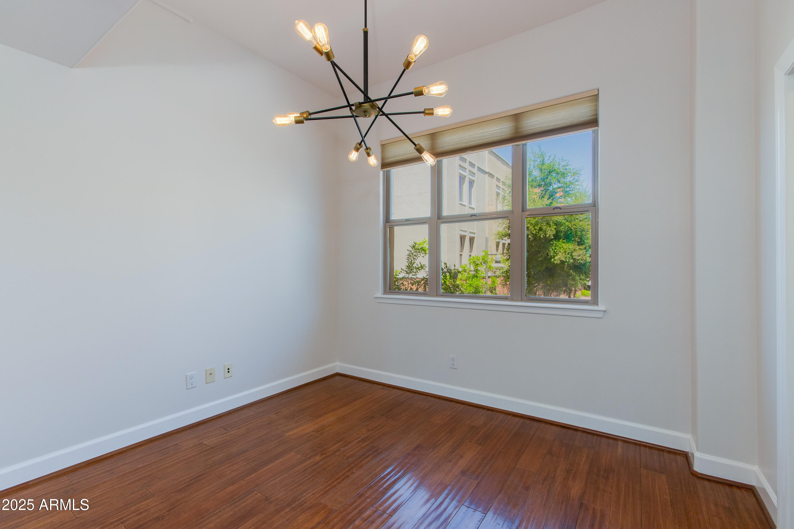 581 South Roosevelt Street Tempe, AZ 85281 - Photo 4 of 14 wooden floor in an empty room with a window