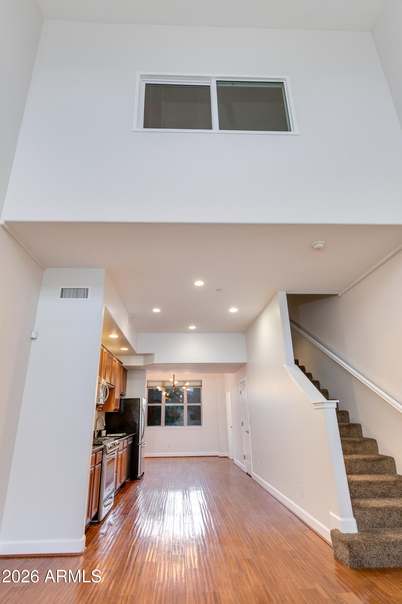 581 South Roosevelt Street Tempe, AZ 85281 - Photo 7 of 14 a view of a hallway with wooden floor and staircase