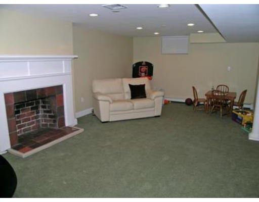 88 Williston Road Brookline, MA 02445 - Photo 12 of 22 a living room with furniture and a fireplace