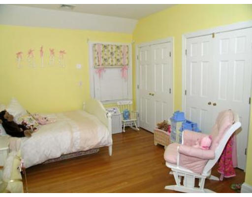 88 Williston Road Brookline, MA 02445 - Photo 16 of 22 a bedroom with a bed and a chair