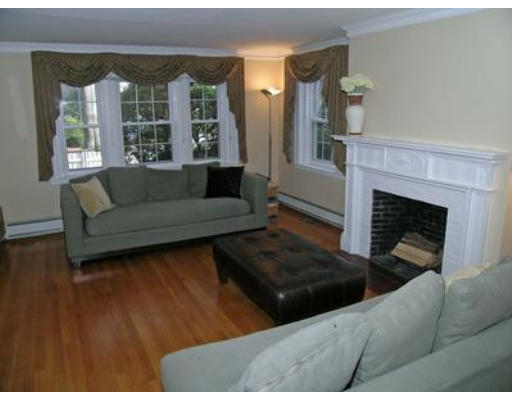 88 Williston Road Brookline, MA 02445 - Photo 3 of 22 a living room with furniture and a fireplace