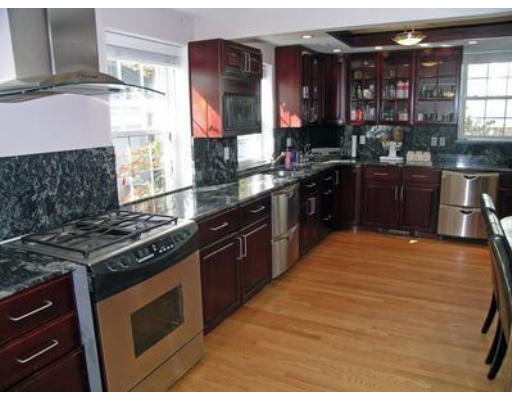 88 Williston Road Brookline, MA 02445 - Photo 4 of 22 a kitchen with stainless steel appliances granite countertop a stove and a sink