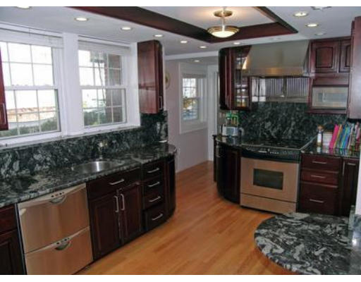 88 Williston Road Brookline, MA 02445 - Photo 5 of 22 a kitchen with stainless steel appliances granite countertop a stove and a sink