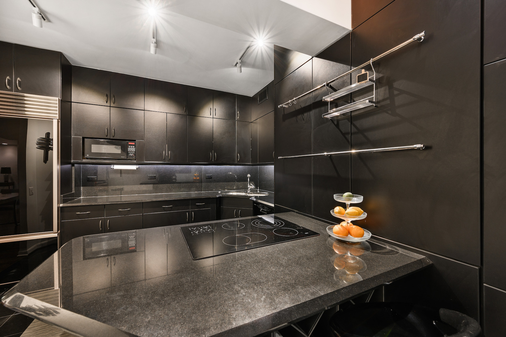 175 East Delaware Place, Unit 46254601 Chicago, IL 60611 - Photo 16 of 33 a kitchen with a sink and stainless steel appliances