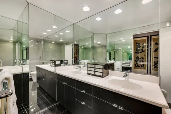 a bathroom with double vanity sinks double vanity and a bathtub