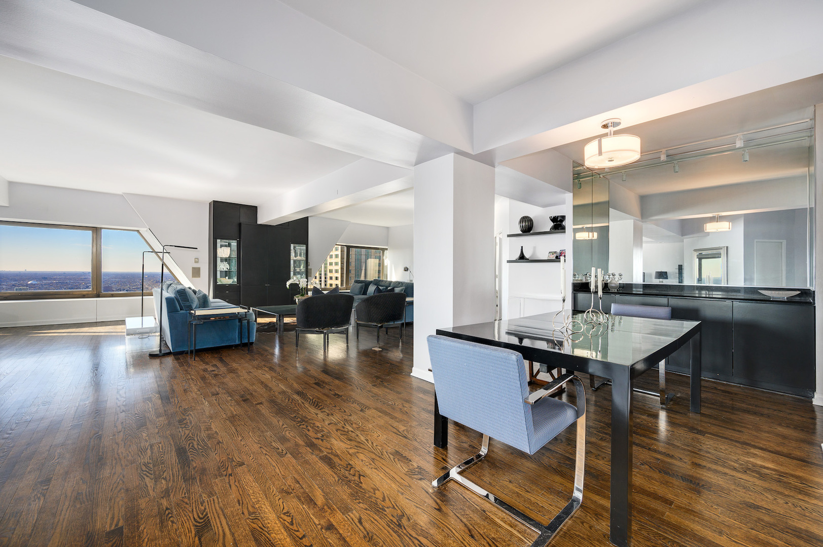 175 East Delaware Place, Unit 46254601 Chicago, IL 60611 - Photo 3 of 33 a living room with furniture and wooden floor
