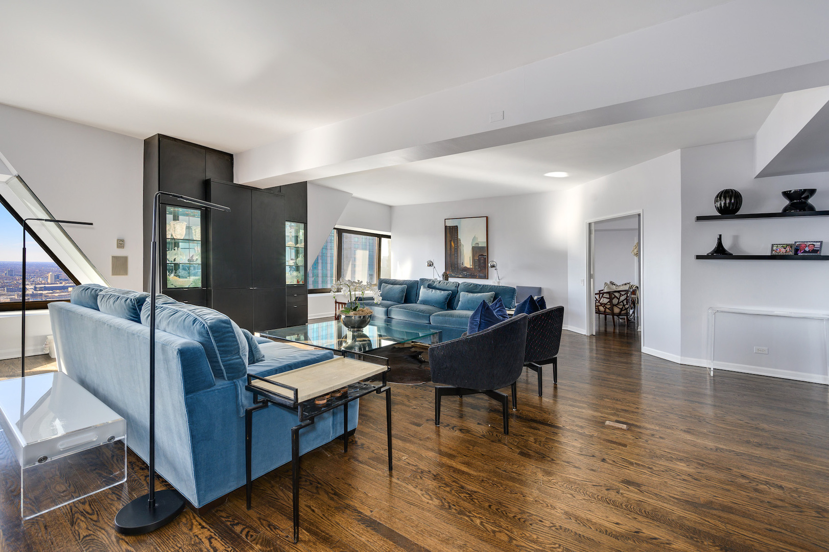 175 East Delaware Place, Unit 46254601 Chicago, IL 60611 - Photo 5 of 33 a living room with furniture and a wooden floor