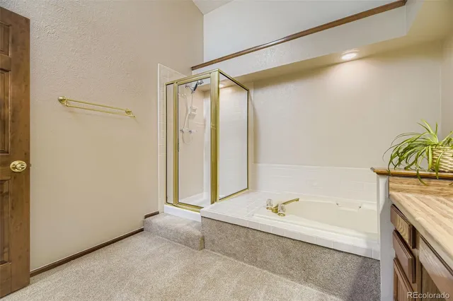 a bathroom with a bathtub and a shower