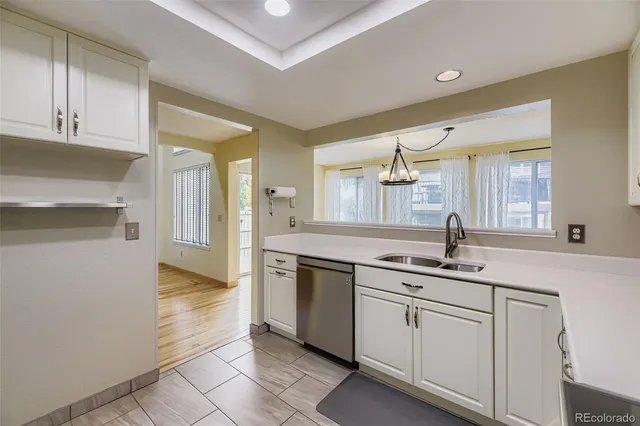 a kitchen with stainless steel appliances granite countertop a sink and cabinets