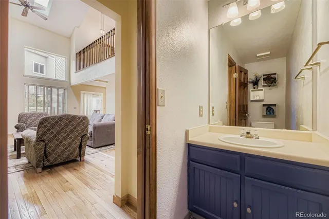 a en suite bathroom with a sink and a mirror