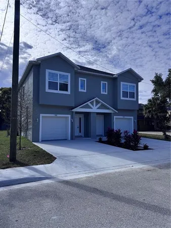 a view of a house with a yard