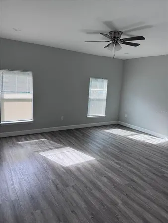 a view of room window and wooden floor