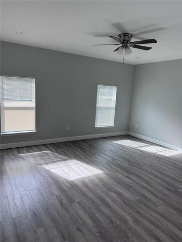 a view of room window and wooden floor