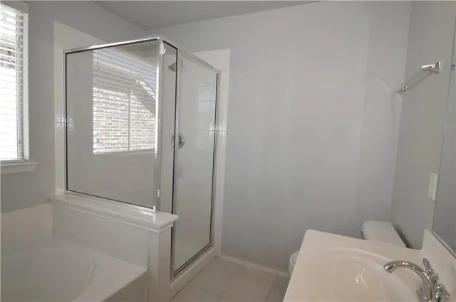 a white bath tub sitting next to a window