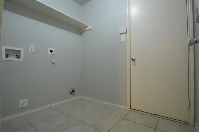 a white toilet sitting next to a white sink