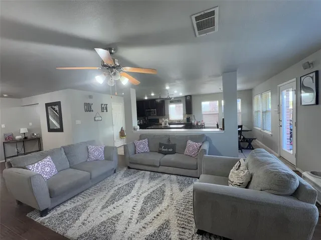 a view of swimming pool with outdoor seating and yard in back