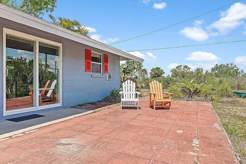 3269 Duncan Road Punta Gorda, FL 33982 - Photo 1 of 1 a view of a chairs and table in front of a house