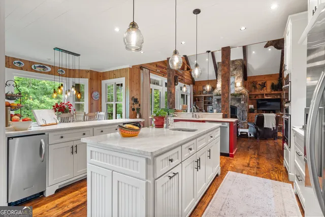 a large bathroom with a granite countertop tub sink shower and mirror