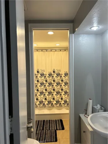 a bathroom with a sink and a shower