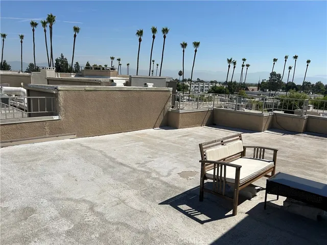 a view of a terrace with furniture