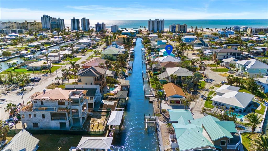 256 Curlew Street Fort Myers Beach, FL 33931 - Photo 36 of 43 VIRTUALLY ENHANCED - Birds eye view of property featuring a water view