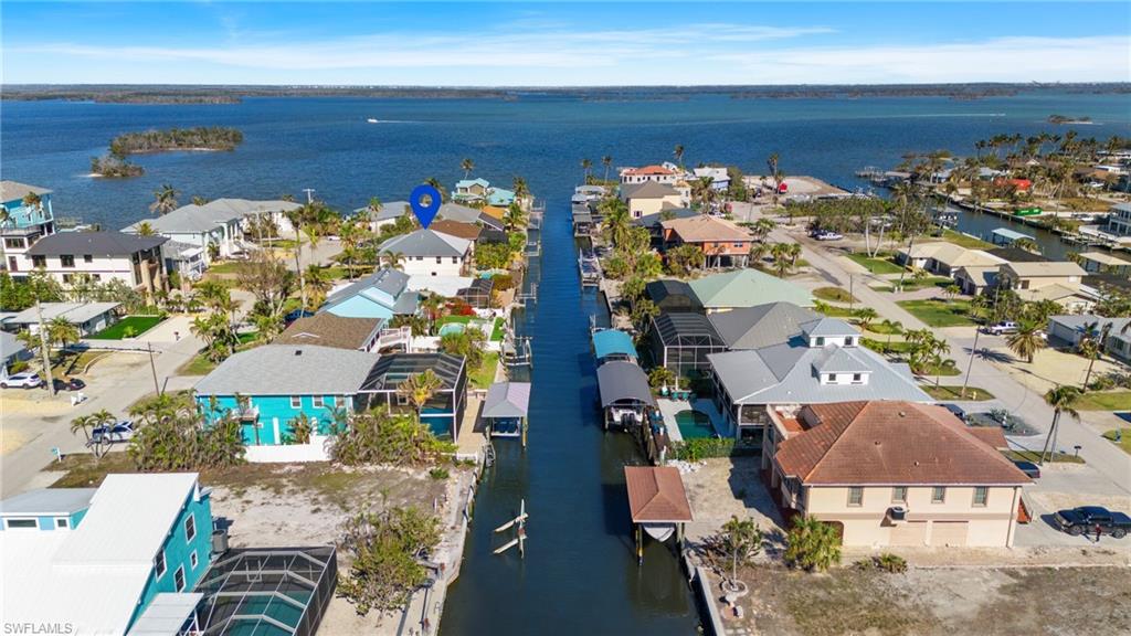 256 Curlew Street Fort Myers Beach, FL 33931 - Photo 37 of 43 VIRTUALLY ENHANCED - Birds eye view of property featuring a water view