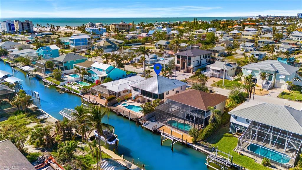 256 Curlew Street Fort Myers Beach, FL 33931 - Photo 38 of 43 VIRTUALLY ENHANCED - Birds eye view of property featuring a water view