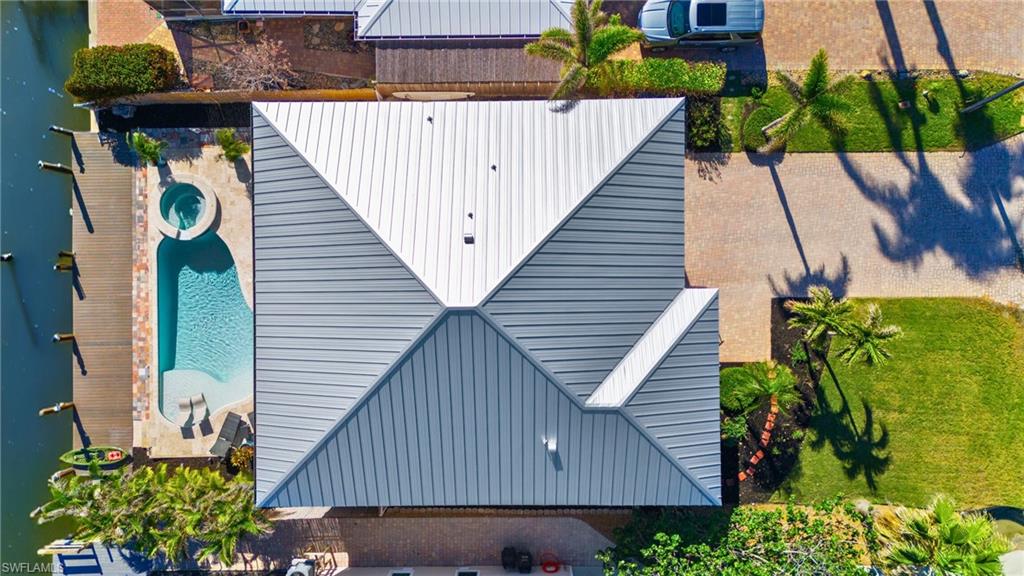 256 Curlew Street Fort Myers Beach, FL 33931 - Photo 39 of 43 VIRTUALLY ENHANCED - Drone / aerial view with a water view